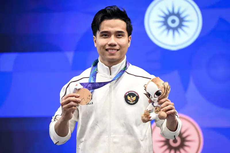 Foto: Aksi Seraf Naro Sumbang Medali Pertama Indonesia di Asian Games 2026